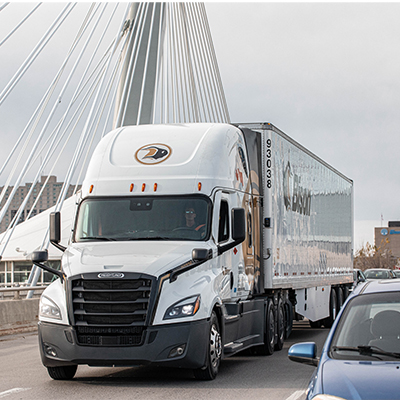 Bison Transport Freightliner truck driving on Provencher Bridge in Winnipeg